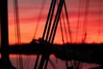 Ropes of the Tsjerk Hiddes against a red evening sky