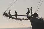 Silhouettes of guests on the bowsprit of the Tsjerk Hiddes