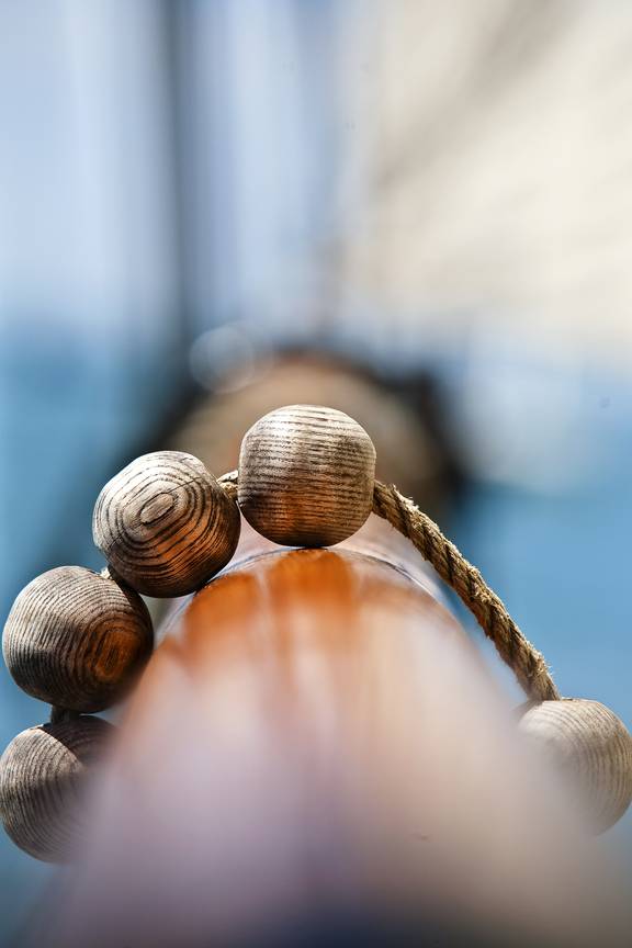 Wooden beads of the rigging around a spar on the Tsjerk Hiddes
