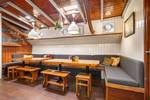 Seating area with wooden tables and benches in the Vriendentrouw