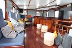 Bench seating and wooden bar in the deckhouse of the Vrijheid