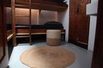 Cabin with wooden bunk beds on the Vrijheid