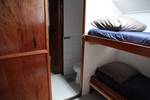 Cabin with a bunk bed and private washroom on the Vrijheid
