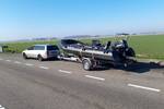 RIB of the Vrijheid on a boat trailer beside the road