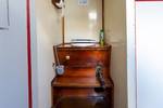 Marine toilet with a wooden surround on the Waterman
