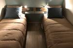 Twin-berth cabin with separate beds on the Wilhelmina