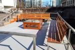 Wooden benches on the deck of the Wilhelmina moored at the quay