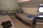 Twin-berth cabin with separate beds on the Wilhelmina