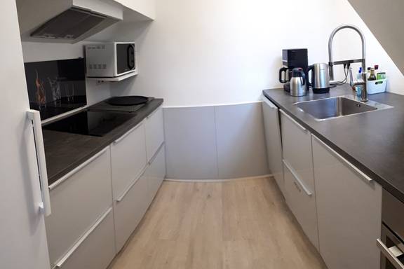 Modern kitchen of the Wilhelmina with grey worktops