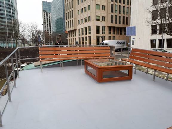 Spacious deck of the Wilhelmina with wooden benches
