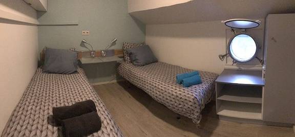 Twin-berth cabin with separate beds on the Wilhelmina