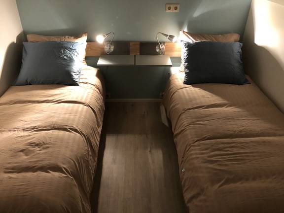 Twin-berth cabin with separate beds on the Wilhelmina