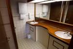 Washroom with two washbasins aboard the Willem Barentsz