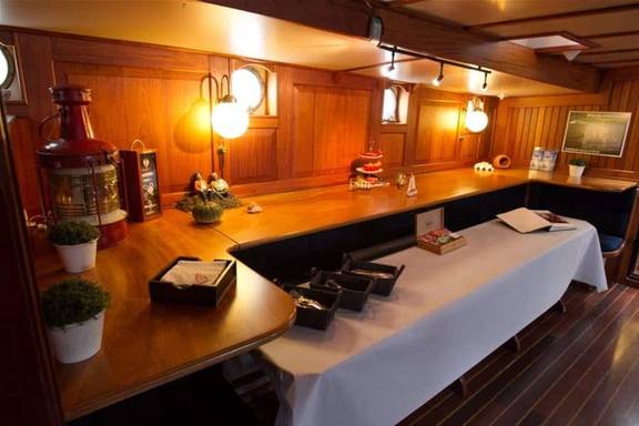 Buffet set up in the wood-panelled saloon of the Willem Barentsz
