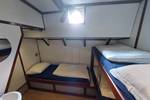 Three-berth cabin with a bunk bed and washbasin on the Johanna Engelina