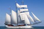 Three-masted Willem Barentsz under white sails on open water