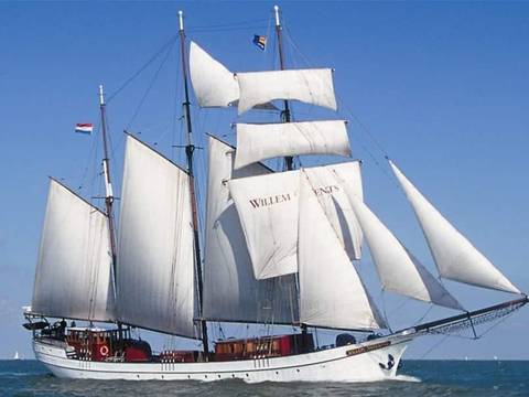 Three-masted Willem Barentsz under white sails on open water