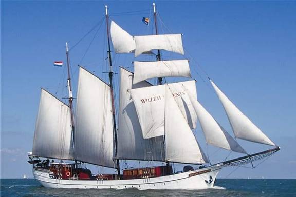 Three-masted Willem Barentsz under white sails on open water