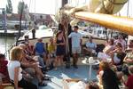 A group in the deck seating area of the Gulden Belofte
