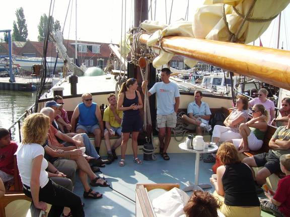 A group in the deck seating area of the Gulden Belofte