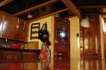 Wood-panelled interior with stairs in the saloon of the Vrouwe Jitske