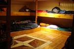 Cabin with wooden bunk beds on the Vrouwe Jitske