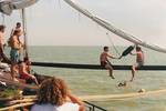 Guests having a pillow fight on the boom of the Vrouwe Jitske