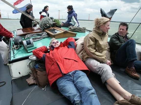 Guests relaxing on the deck of the Vrouwe Jitske