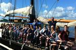 A group of pupils on the deck of the Korevaer in the harbour