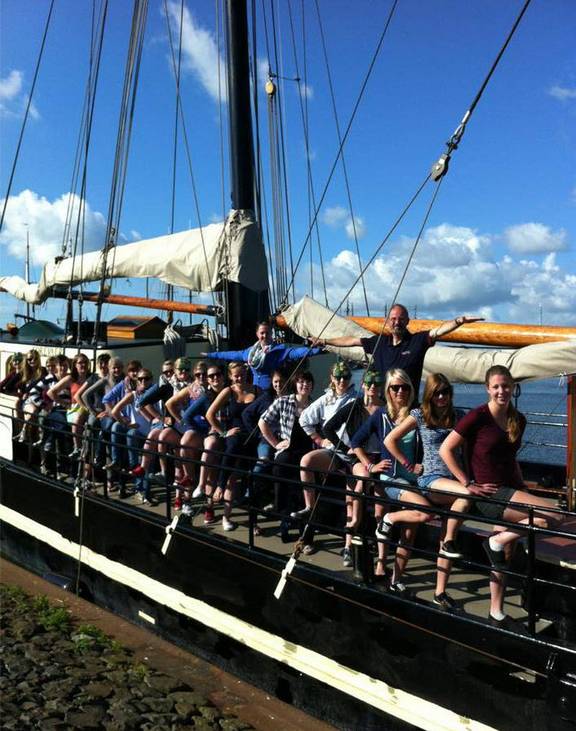 A group of pupils on the deck of the Korevaer in the harbour