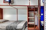 Sleeping cabin with a wardrobe and private washroom on the Mare fan Fryslân