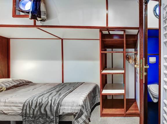 Sleeping cabin with a wardrobe and private washroom on the Mare fan Fryslân