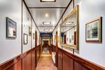 Wood-panelled corridor along the cabins of the Mare fan Fryslân