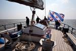 Guests relaxing on the aft deck of the Mare fan Fryslân